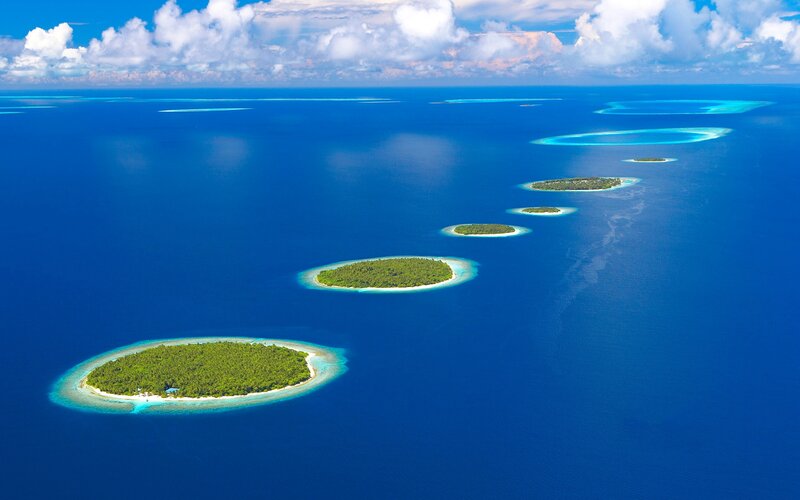 Coral Atolls in Ocean — Blue