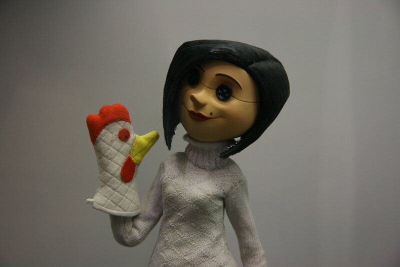 Coraline doll with chicken mitt