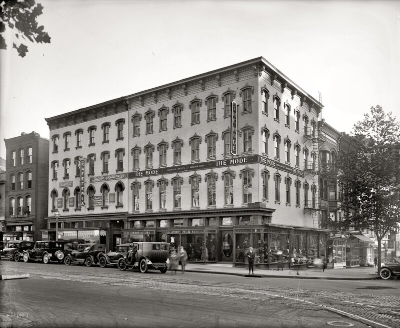 Corner building with vintage cars