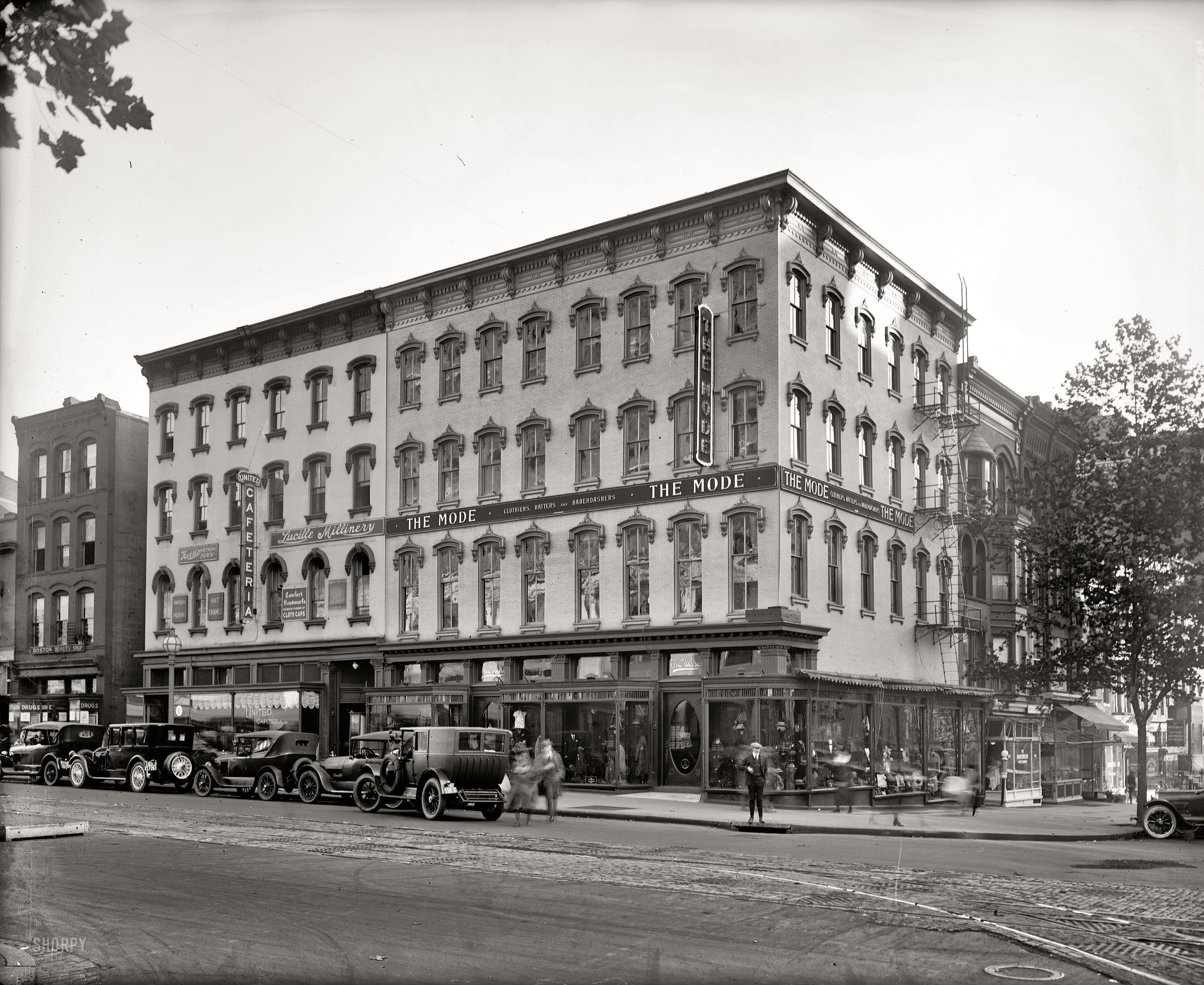 Corner building with vintage cars