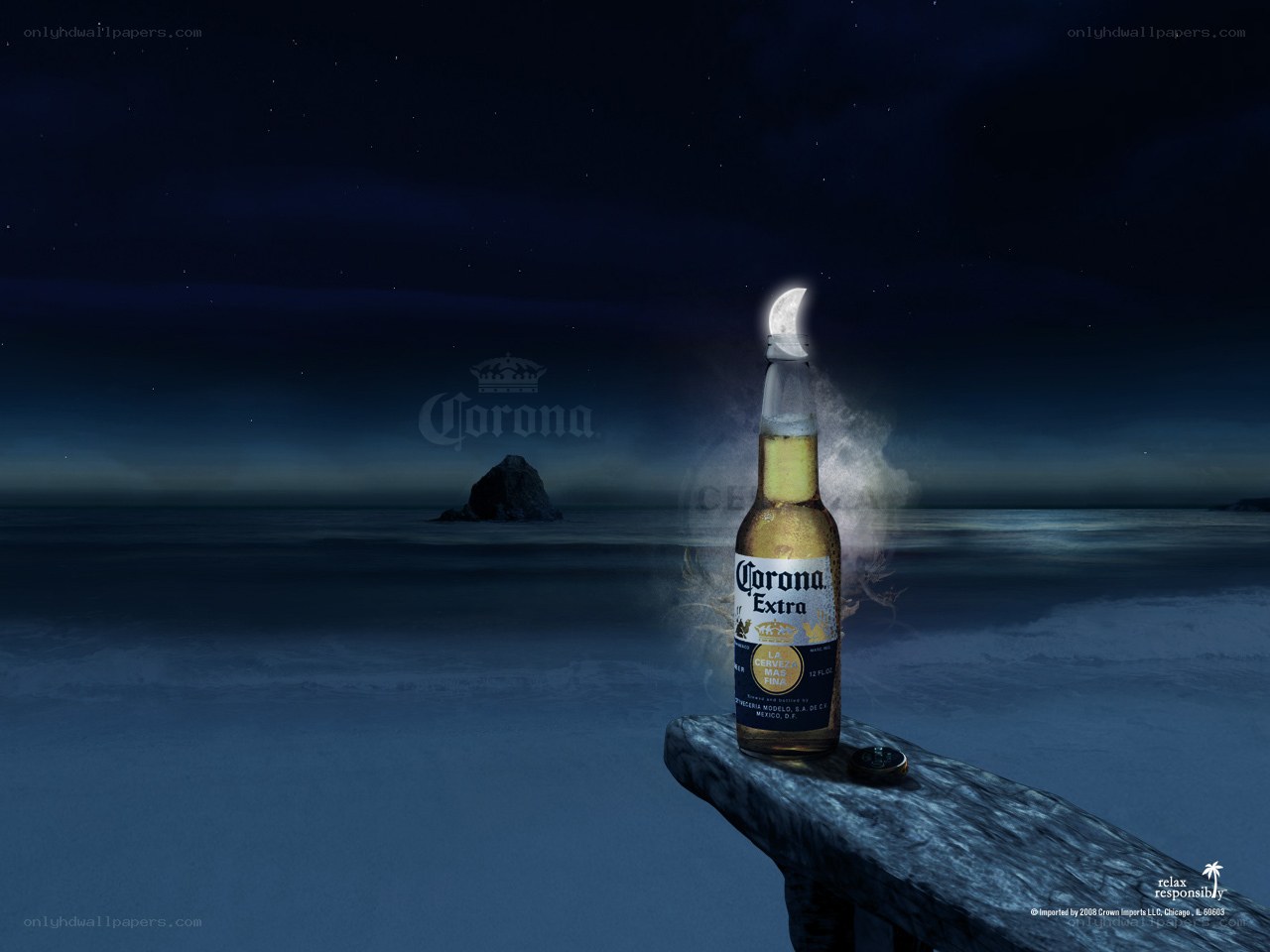 Corona bottle on a moonlit beach