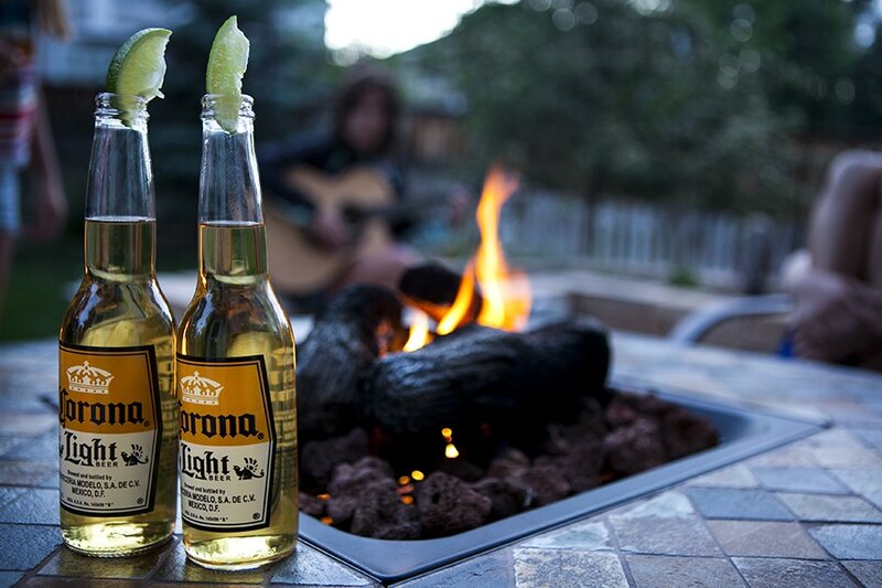 Corona bottles by fire pit