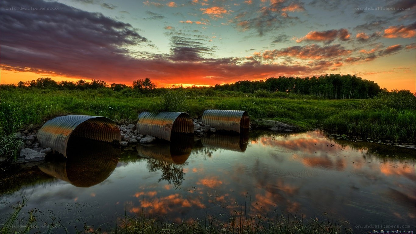 Corrugated pipes at sunset
