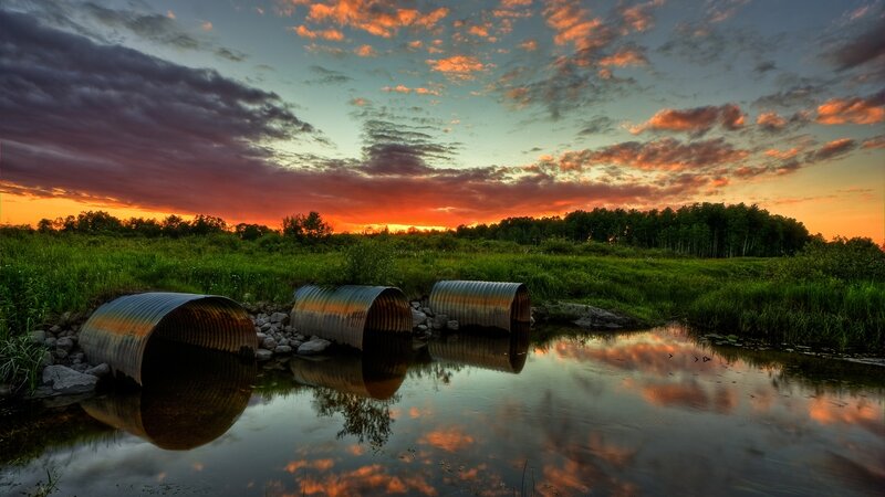 Corrugated Pipes in Stream — Orange