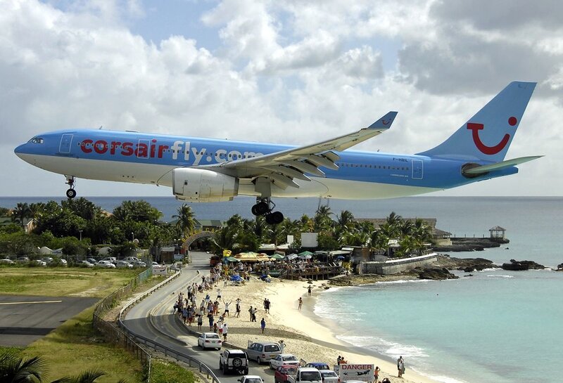 Corsair airplane landing near beach