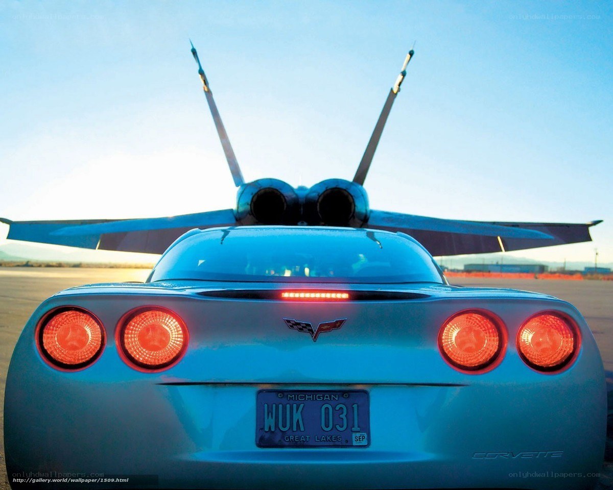 Corvette and jet on tarmac