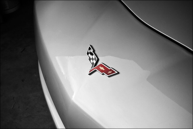 Corvette Emblem on Car — White