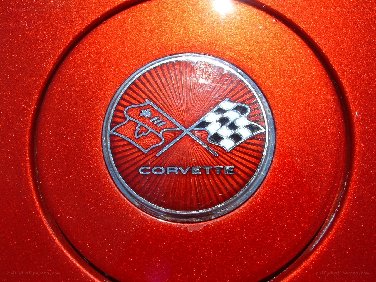 Corvette emblem on red car
