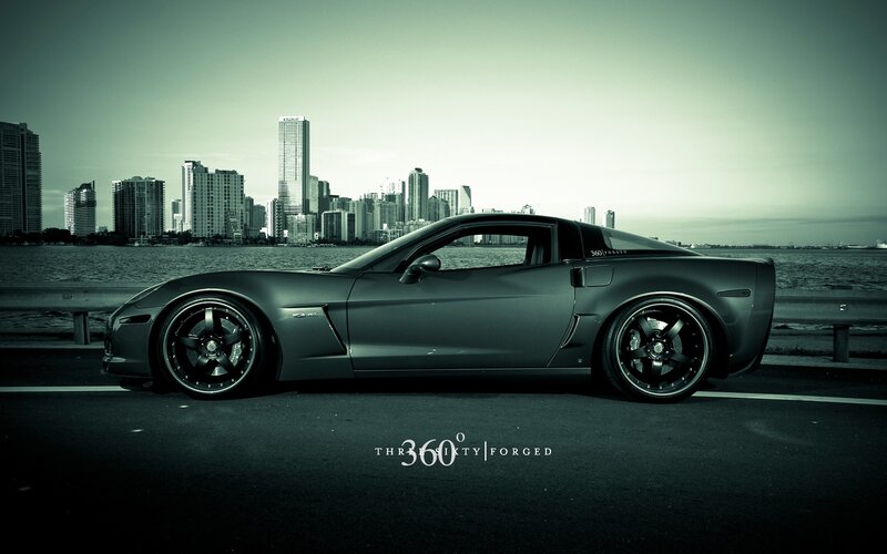 Corvette with city skyline