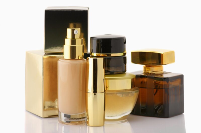Cosmetic Products on White — Gold, Clean