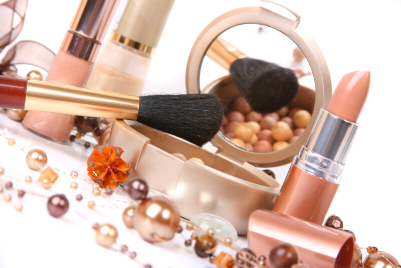 Cosmetic Products on White — Gold
