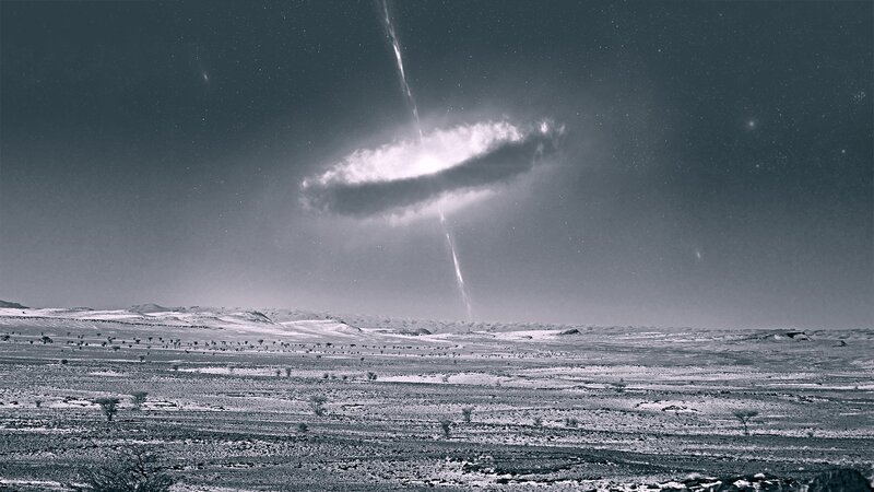 Cosmic event over desert landscape
