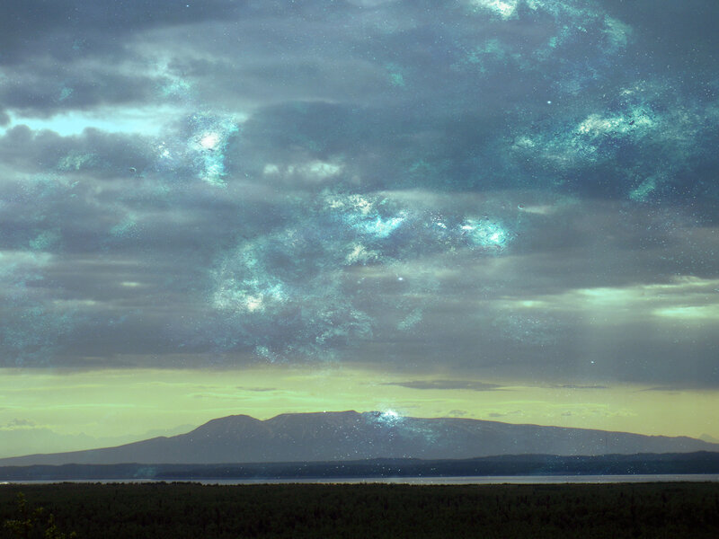 Cosmic sky over mountain landscape