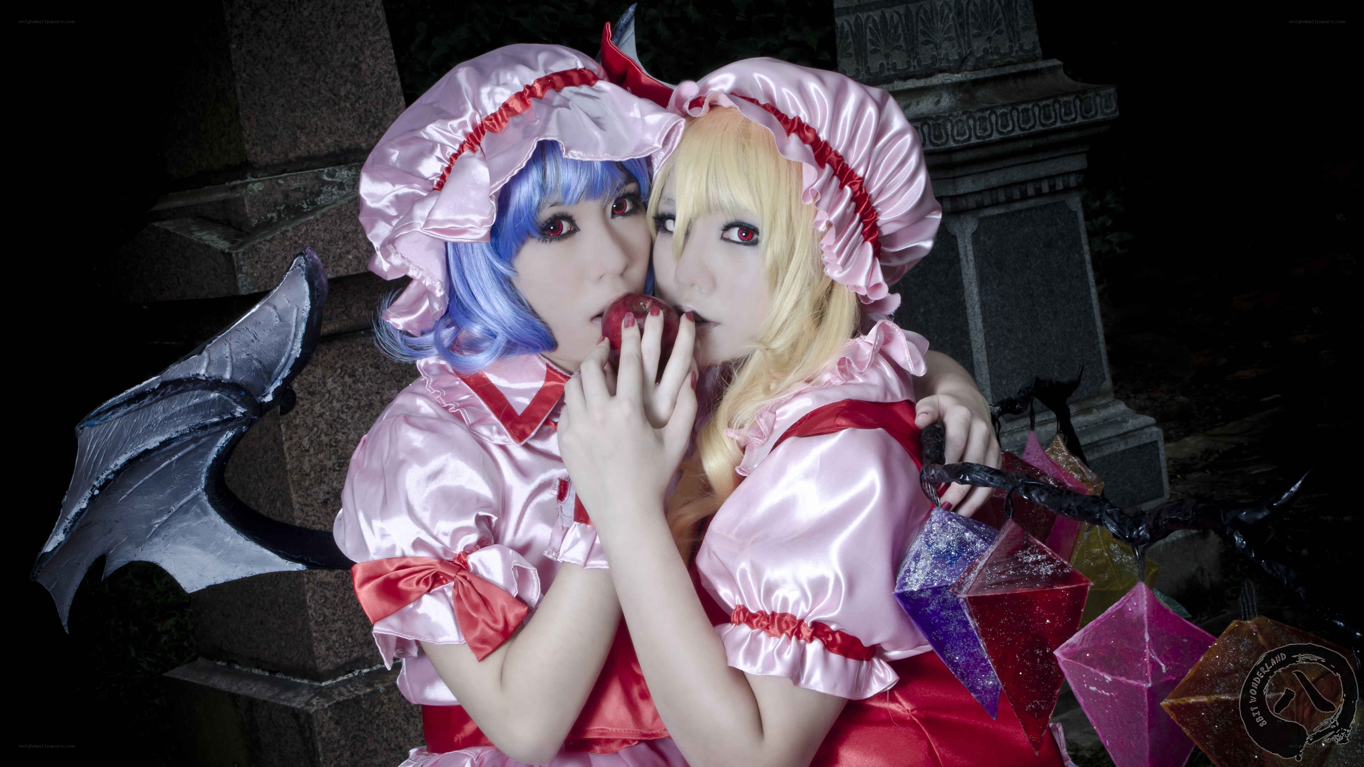 cosplay of two characters with apples