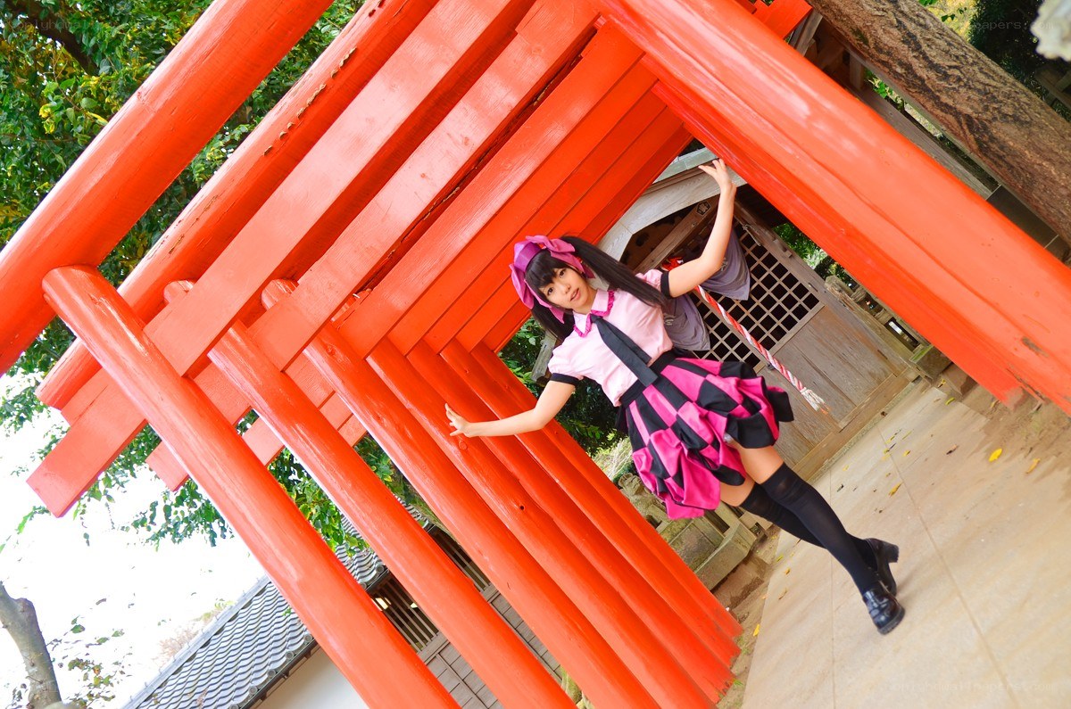 cosplayer at a red torii gate