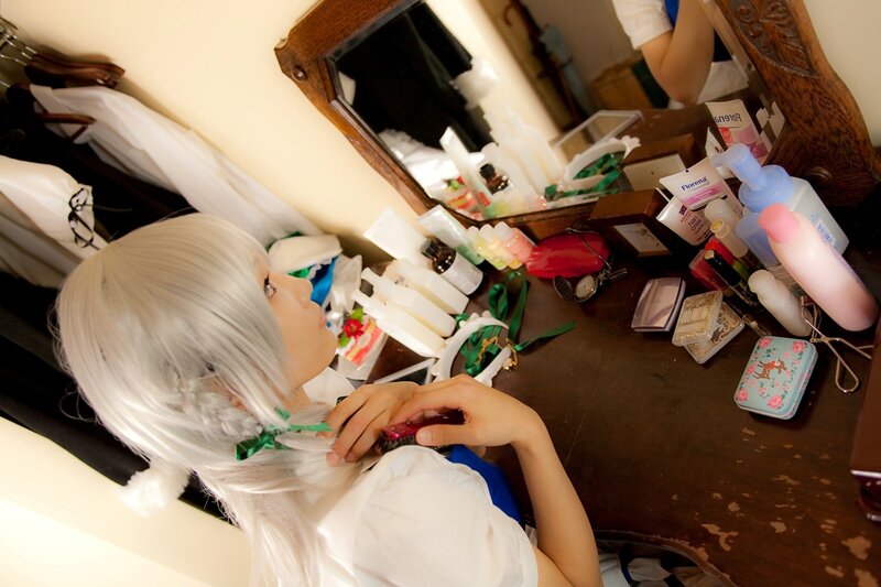 cosplayer at vanity table