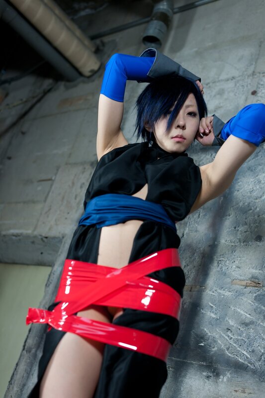 cosplayer bound with red tape