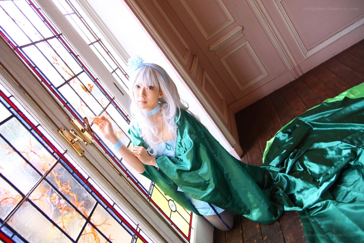 cosplayer by stained glass window