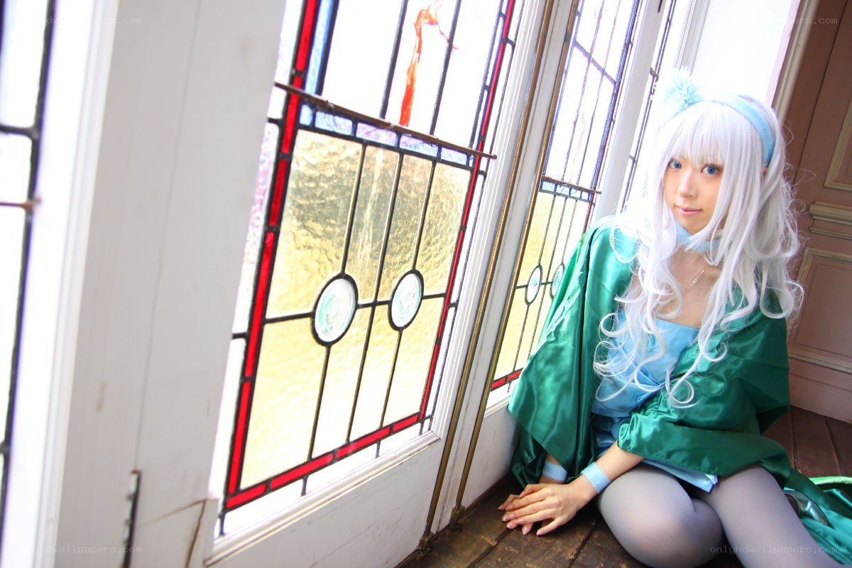 cosplayer by stained glass window