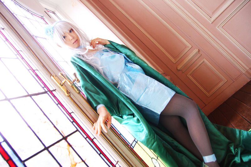 cosplayer by stained glass window