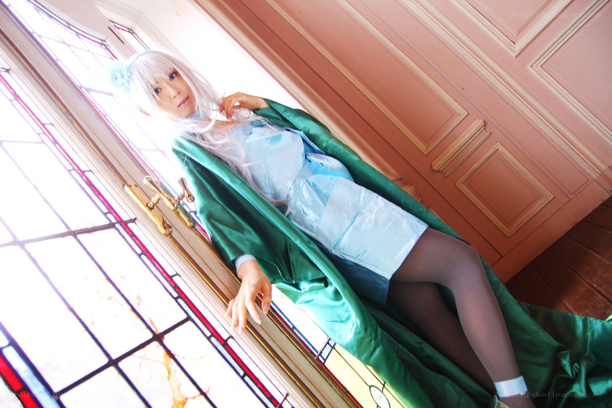 cosplayer by stained glass window