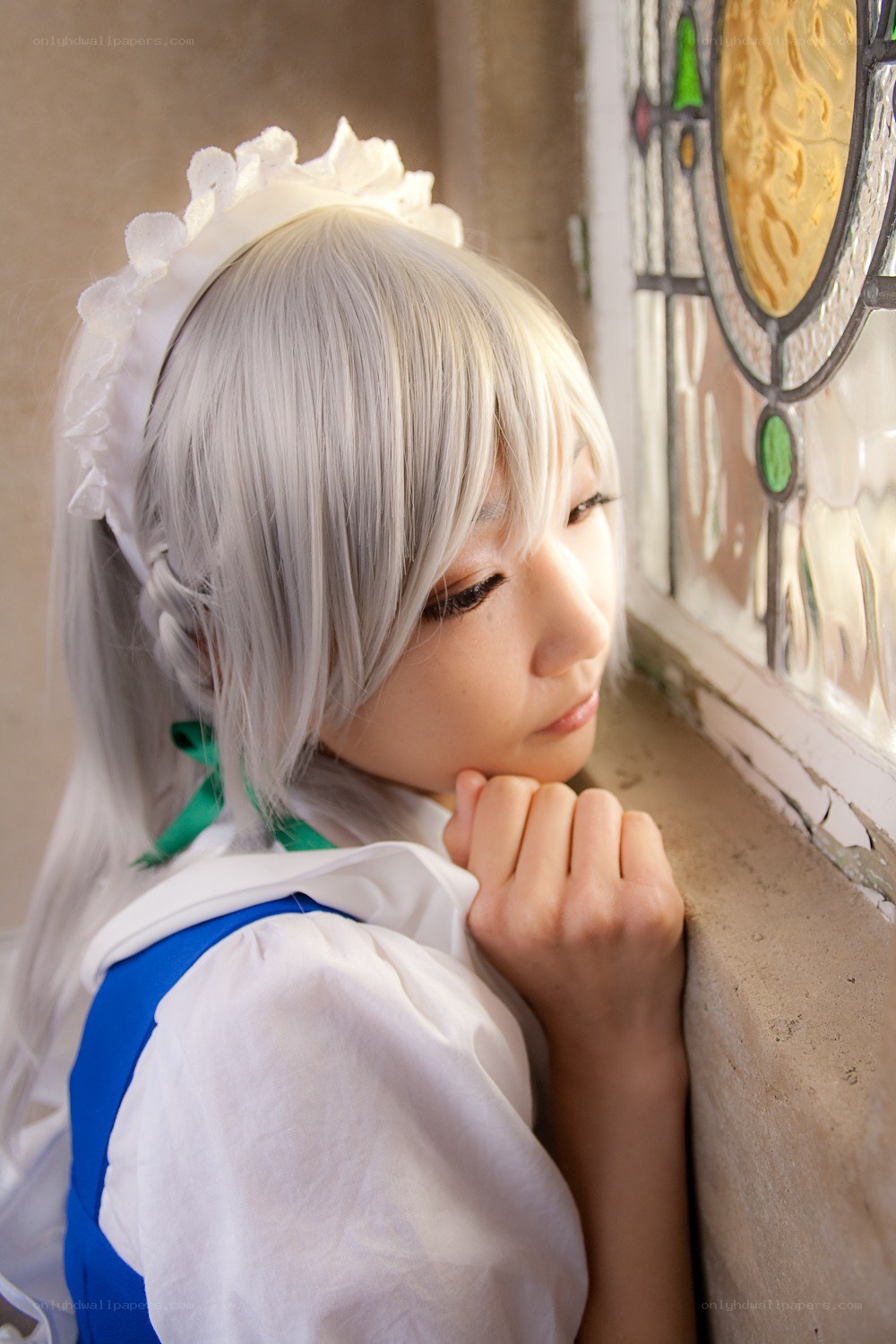 cosplayer by stained glass window
