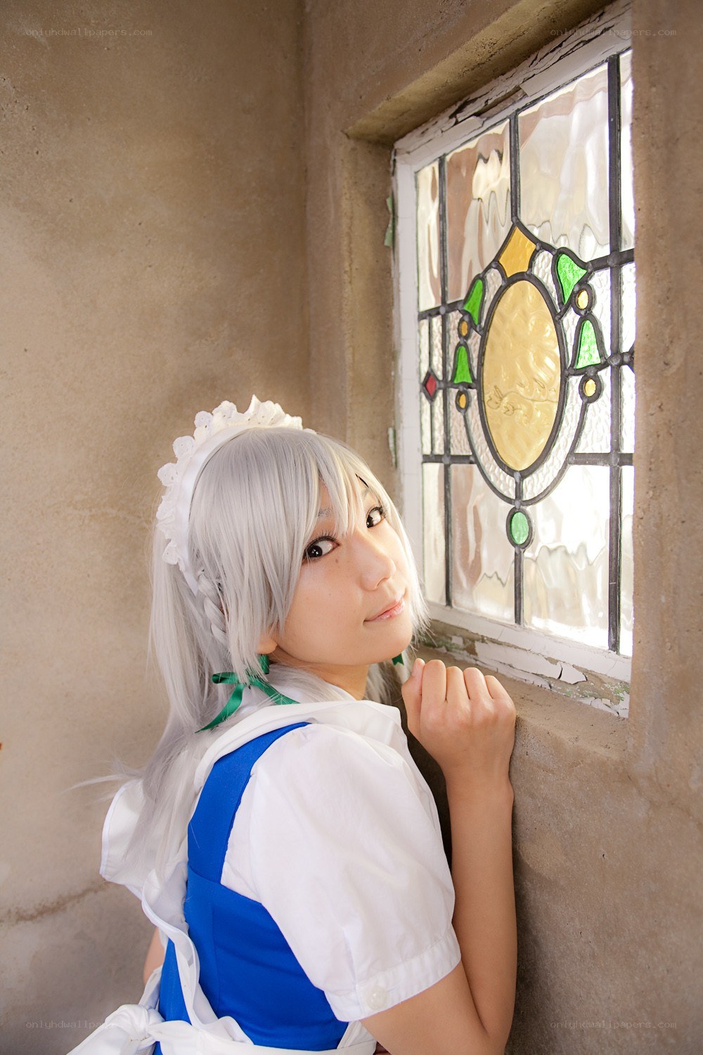 cosplayer by stained glass window
