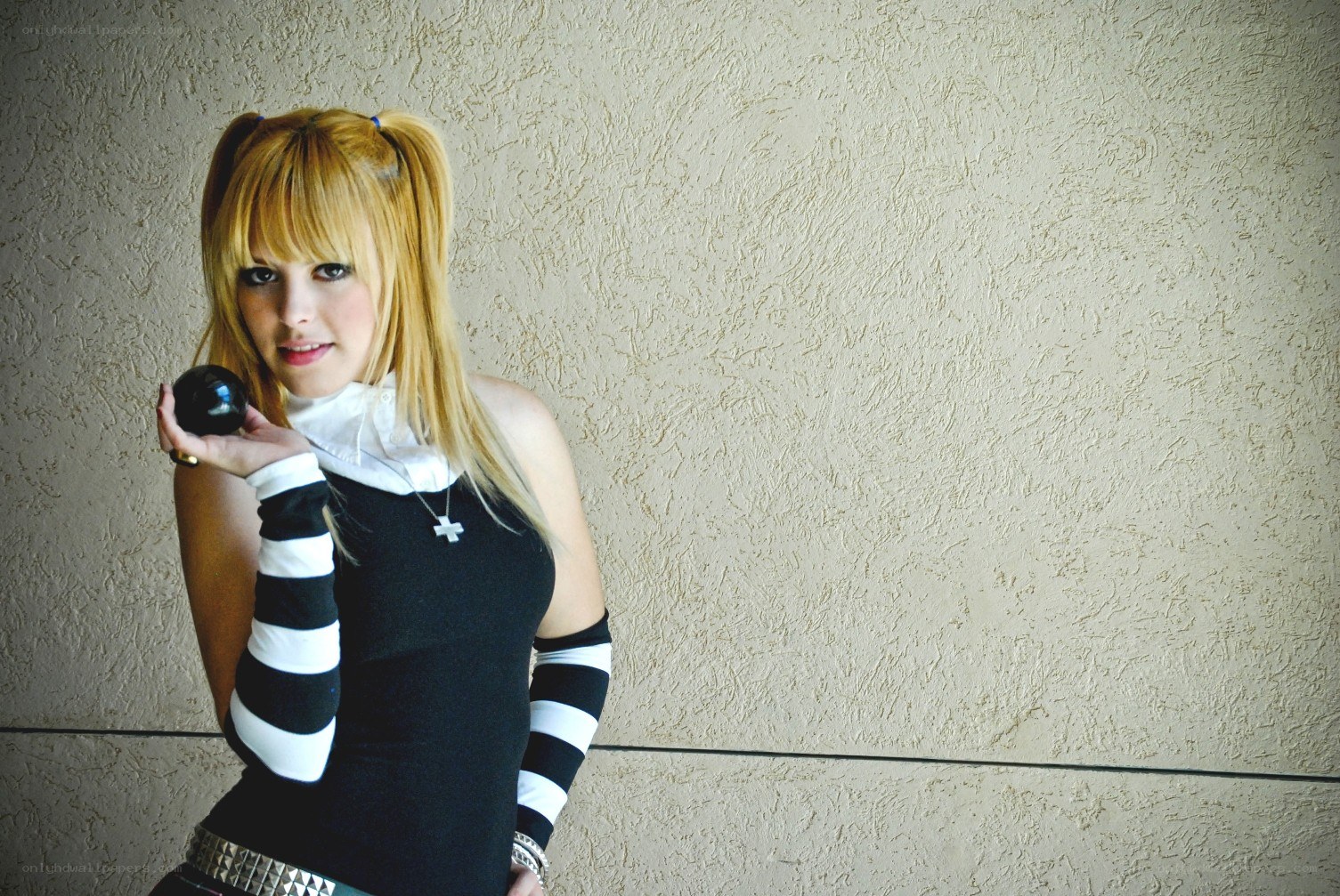 cosplayer holding a black ball