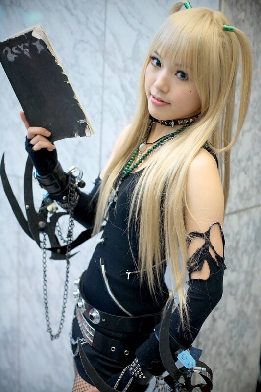 cosplayer holding a book