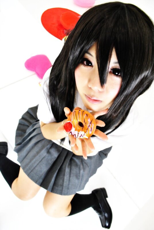 cosplayer holding a donut