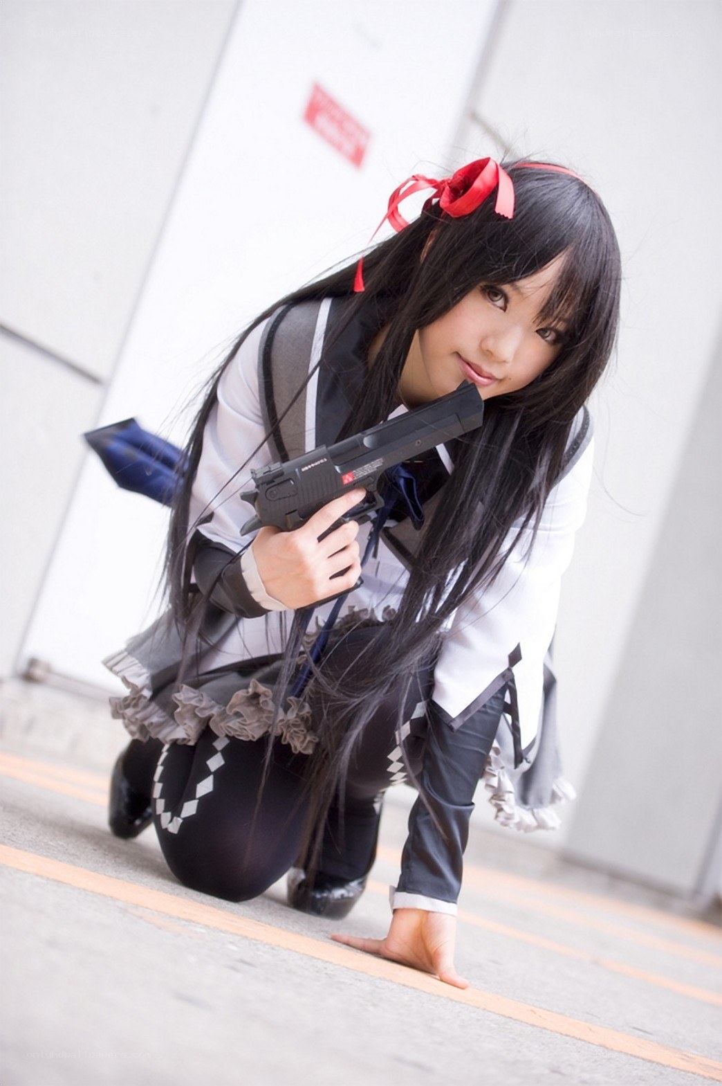 cosplayer holding a gun