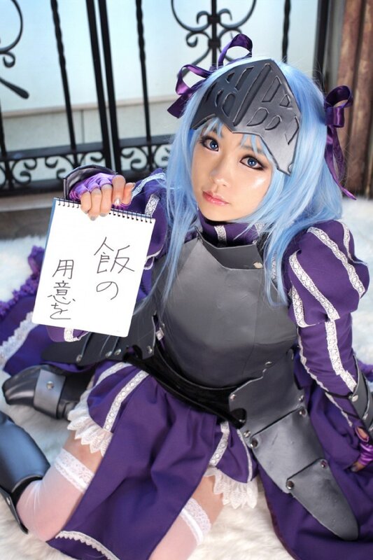 cosplayer holding a sign