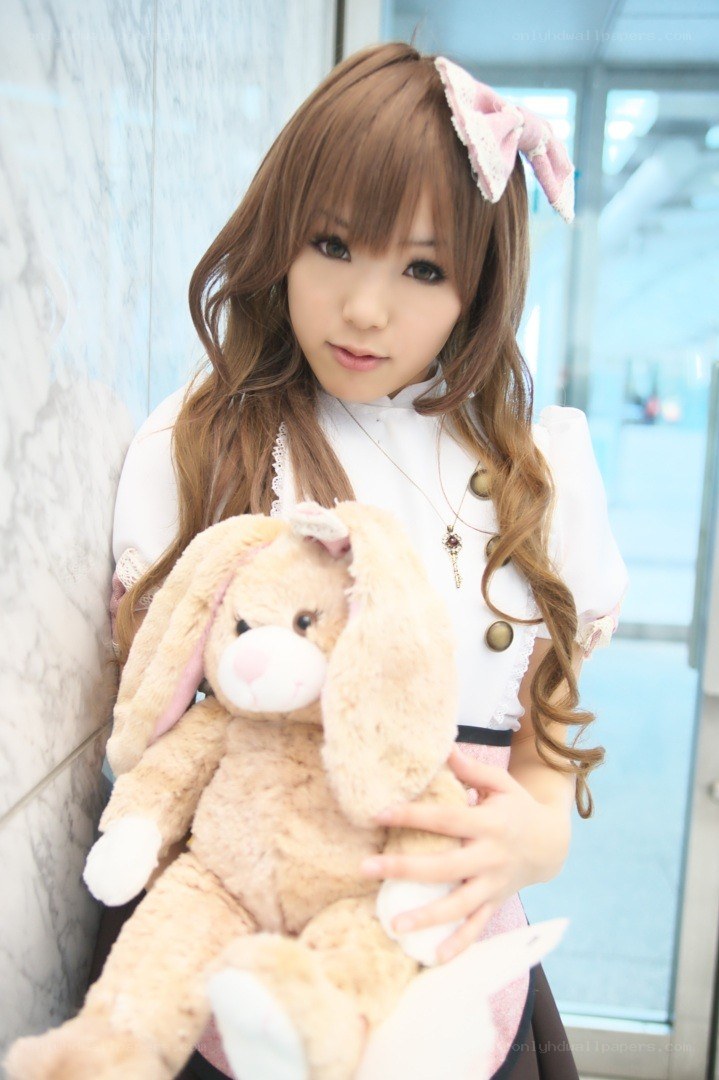 cosplayer holding bunny plush