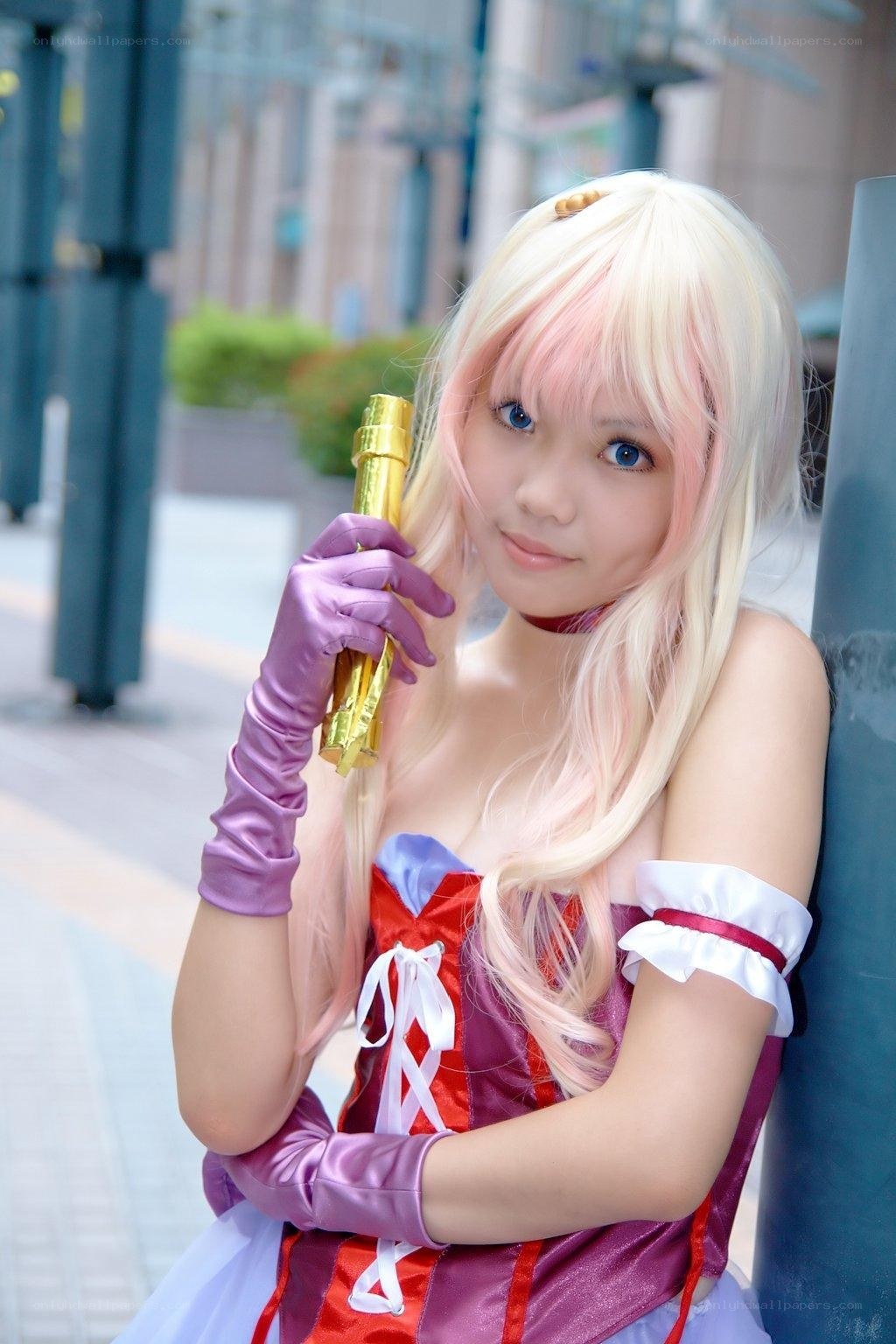 cosplayer holding golden staff