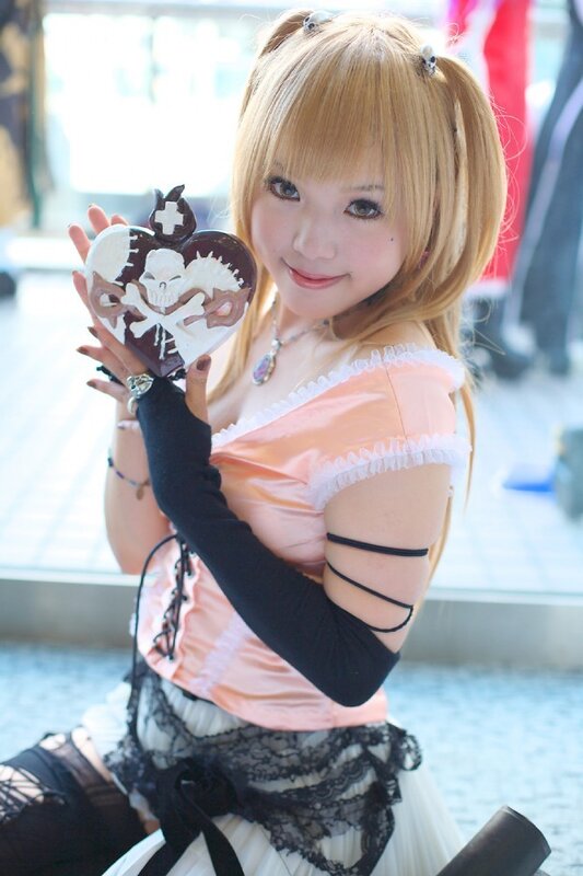 cosplayer holding heart-shaped object