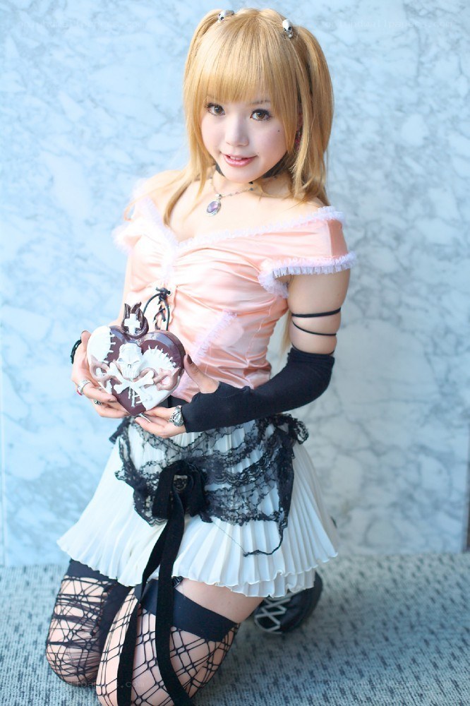 cosplayer holding heart-shaped object