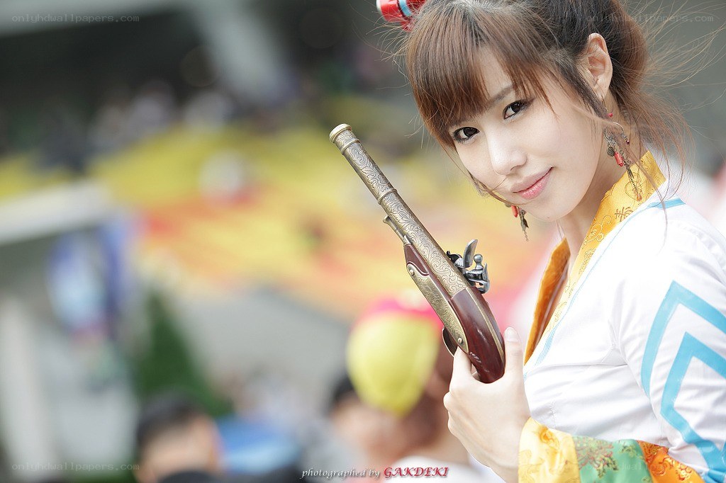 cosplayer holding ornate pistol