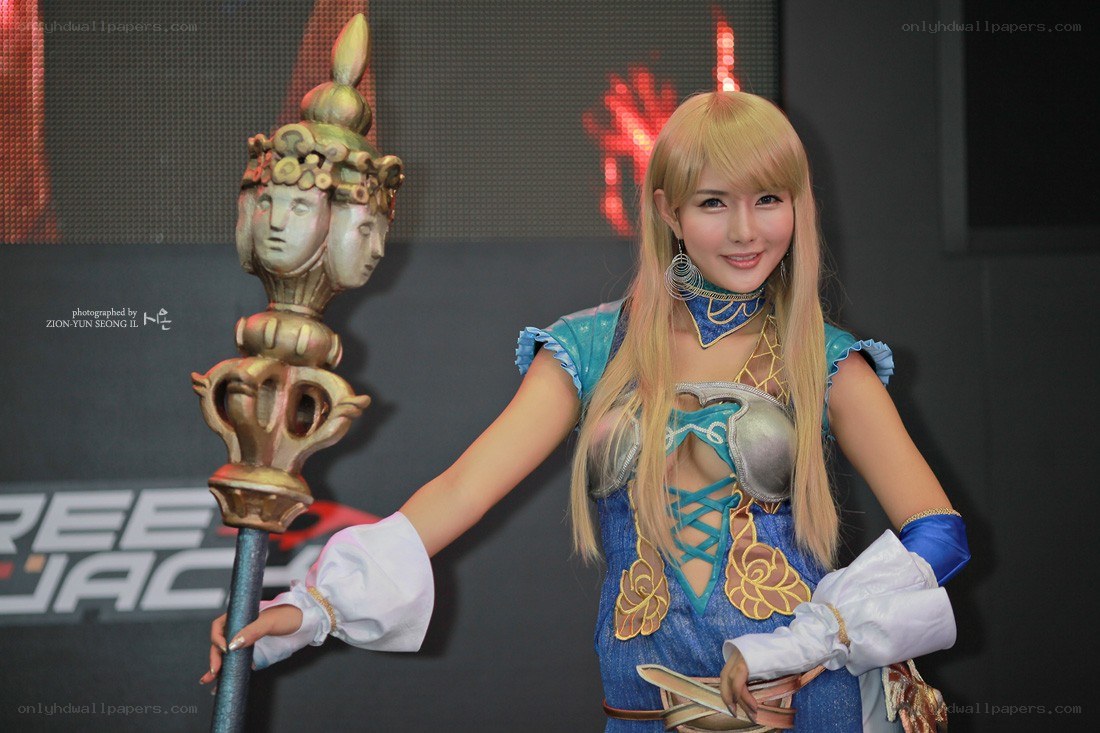 cosplayer holding ornate staff