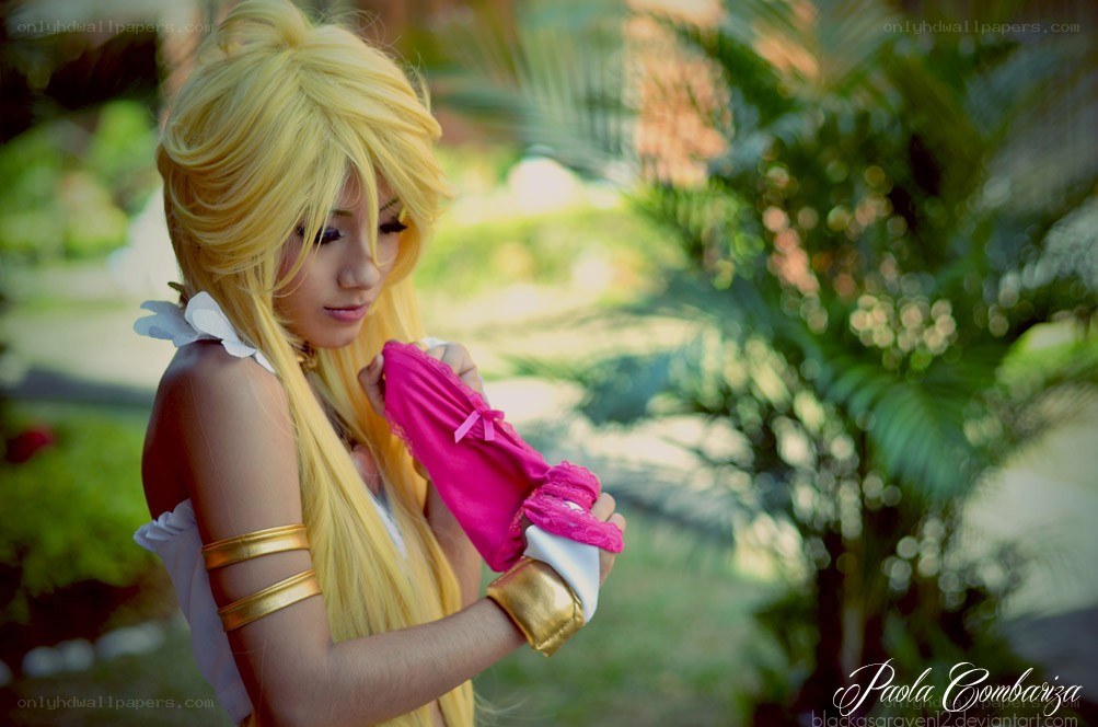 cosplayer holding pink glove