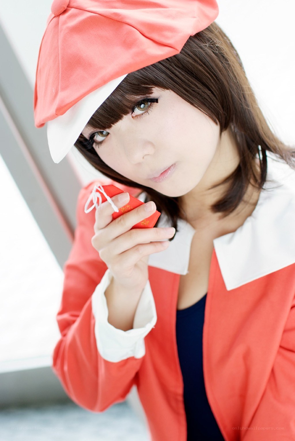 cosplayer holding red box