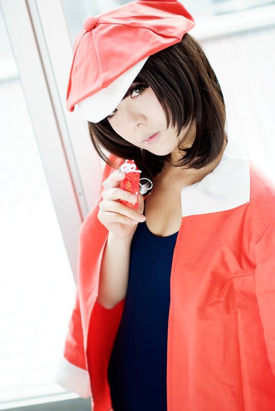 cosplayer holding red charm