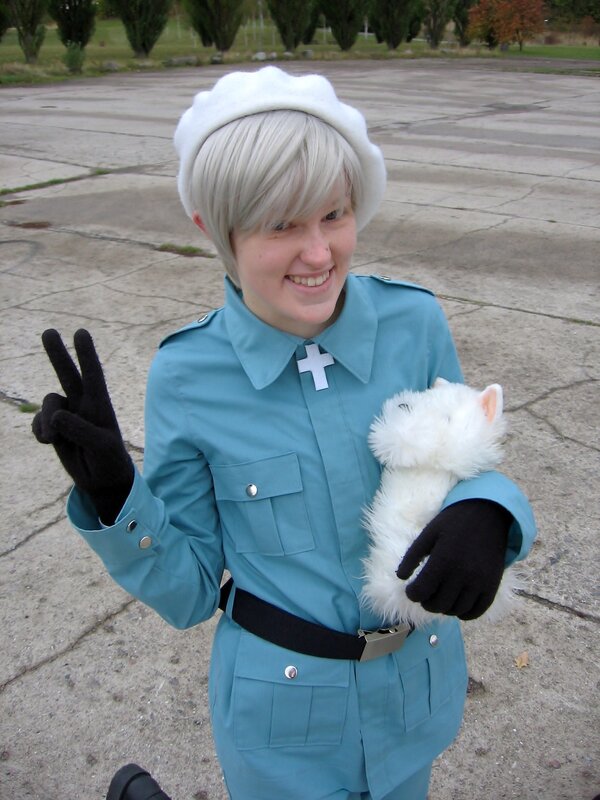 cosplayer holding stuffed animal