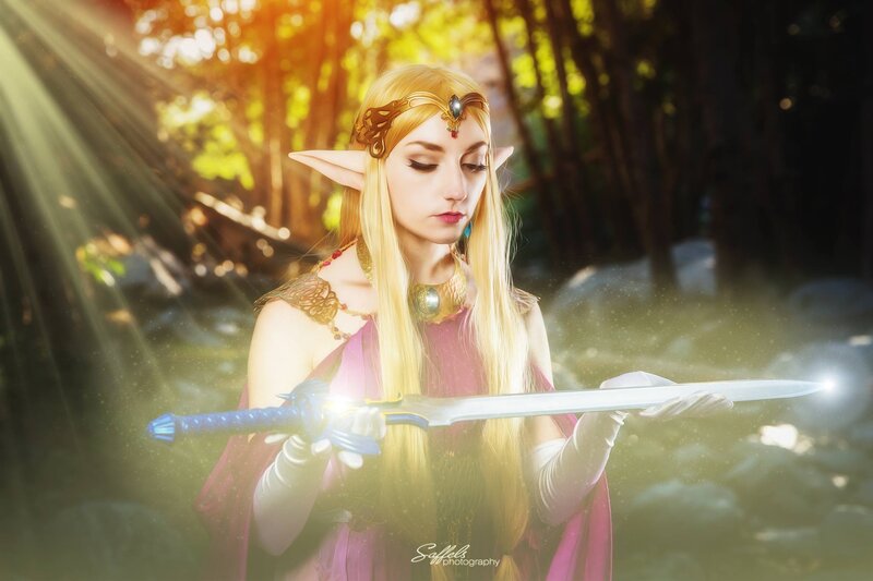 Cosplayer Holding Sword — Gold