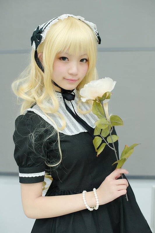 cosplayer holding white rose