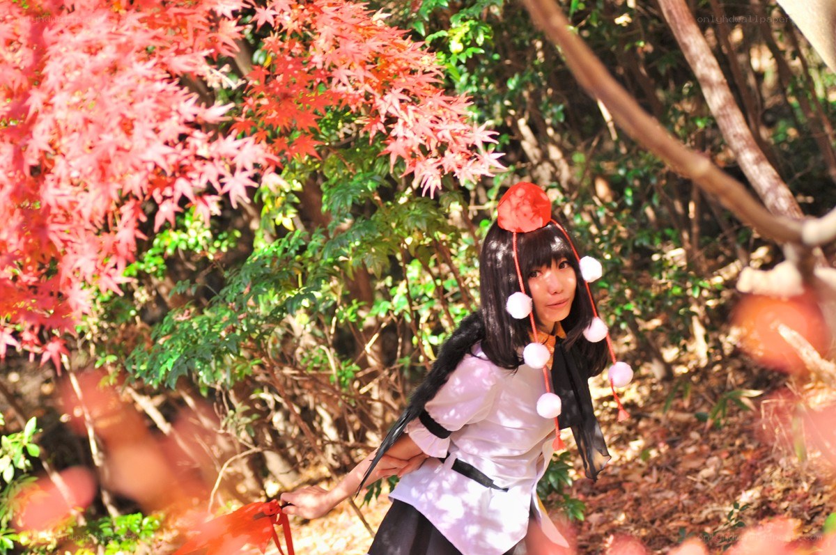 cosplayer in autumn forest