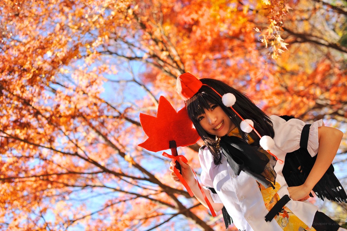 cosplayer in autumn leaves
