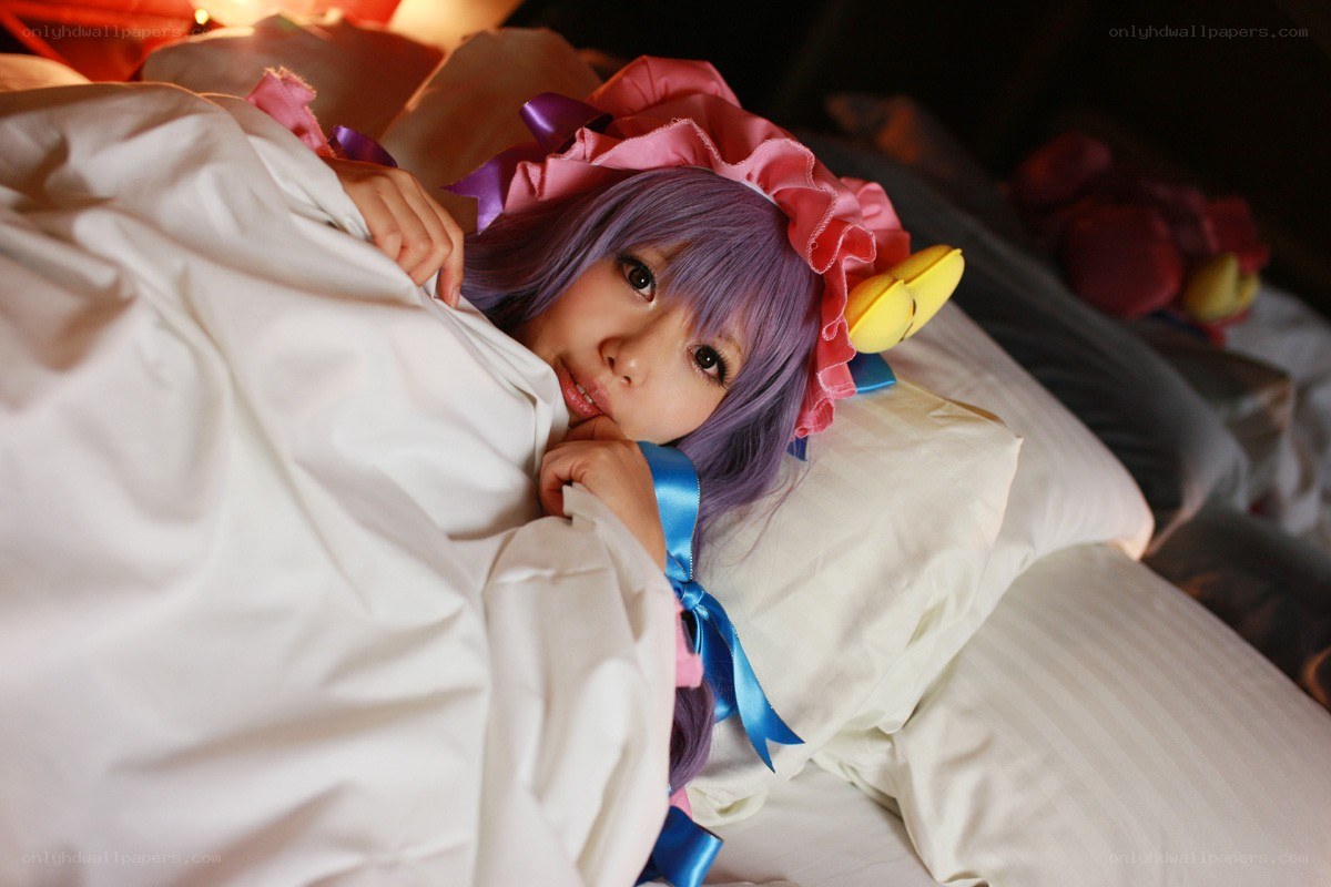 cosplayer in bed with costume