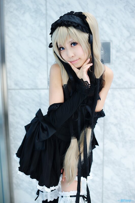 cosplayer in black maid outfit