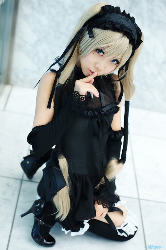 cosplayer in black maid outfit