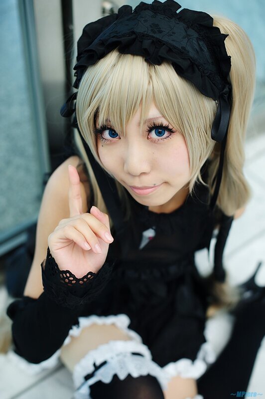 cosplayer in black maid outfit